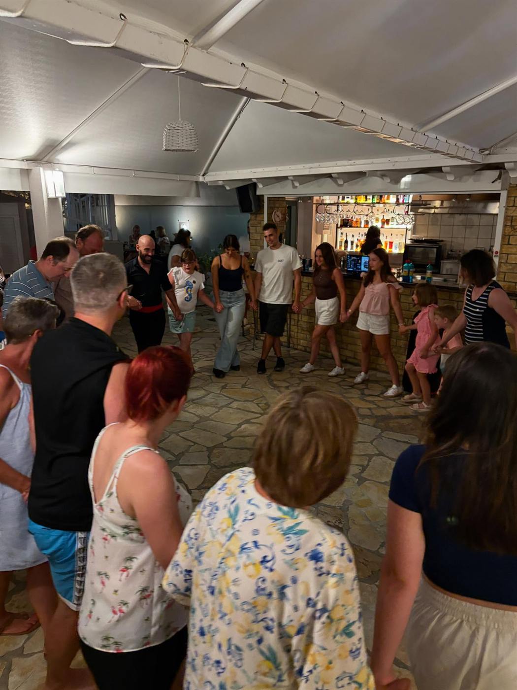 A group dancing in a circle.